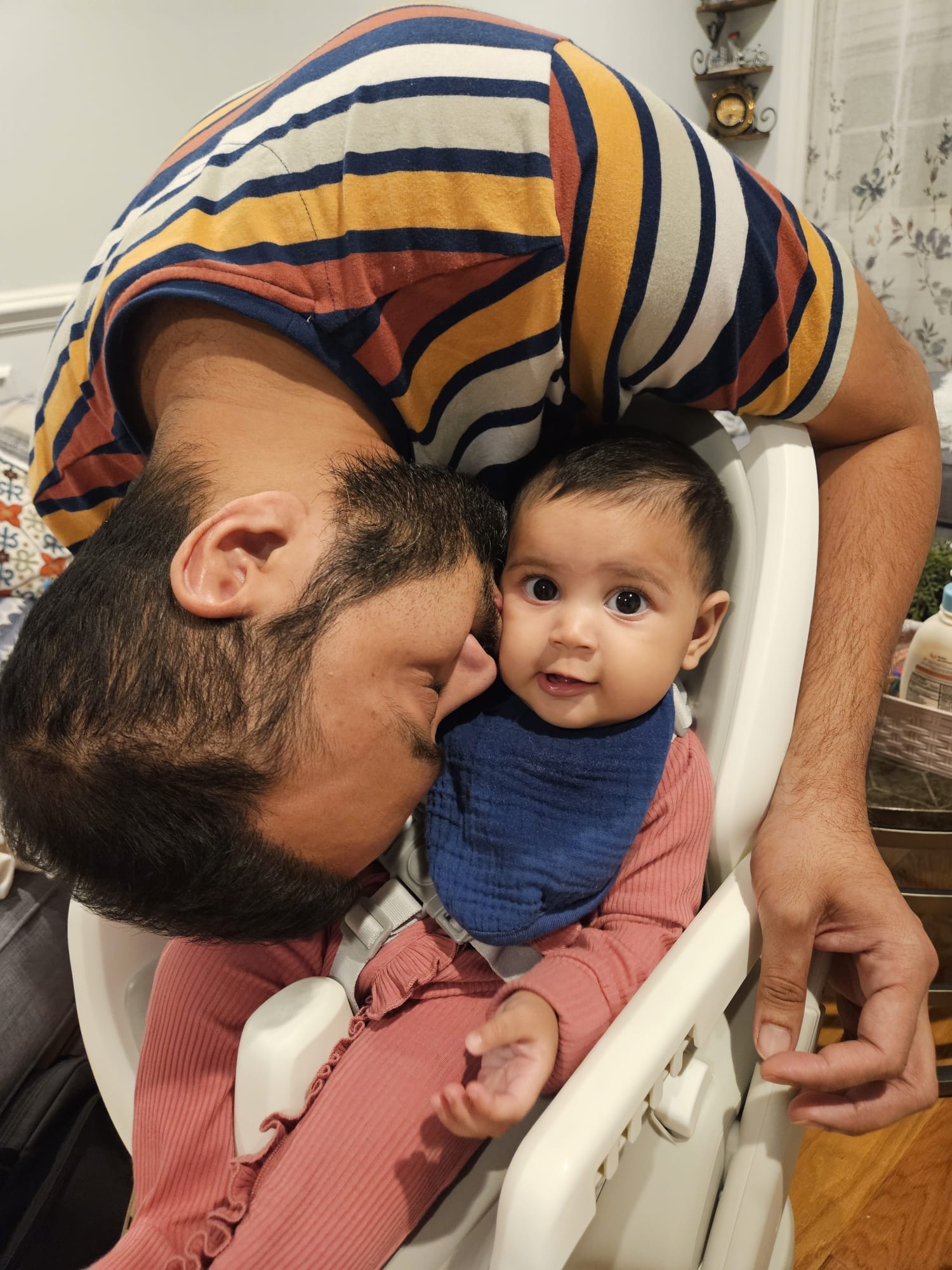 Faatiha snuggling with her dad