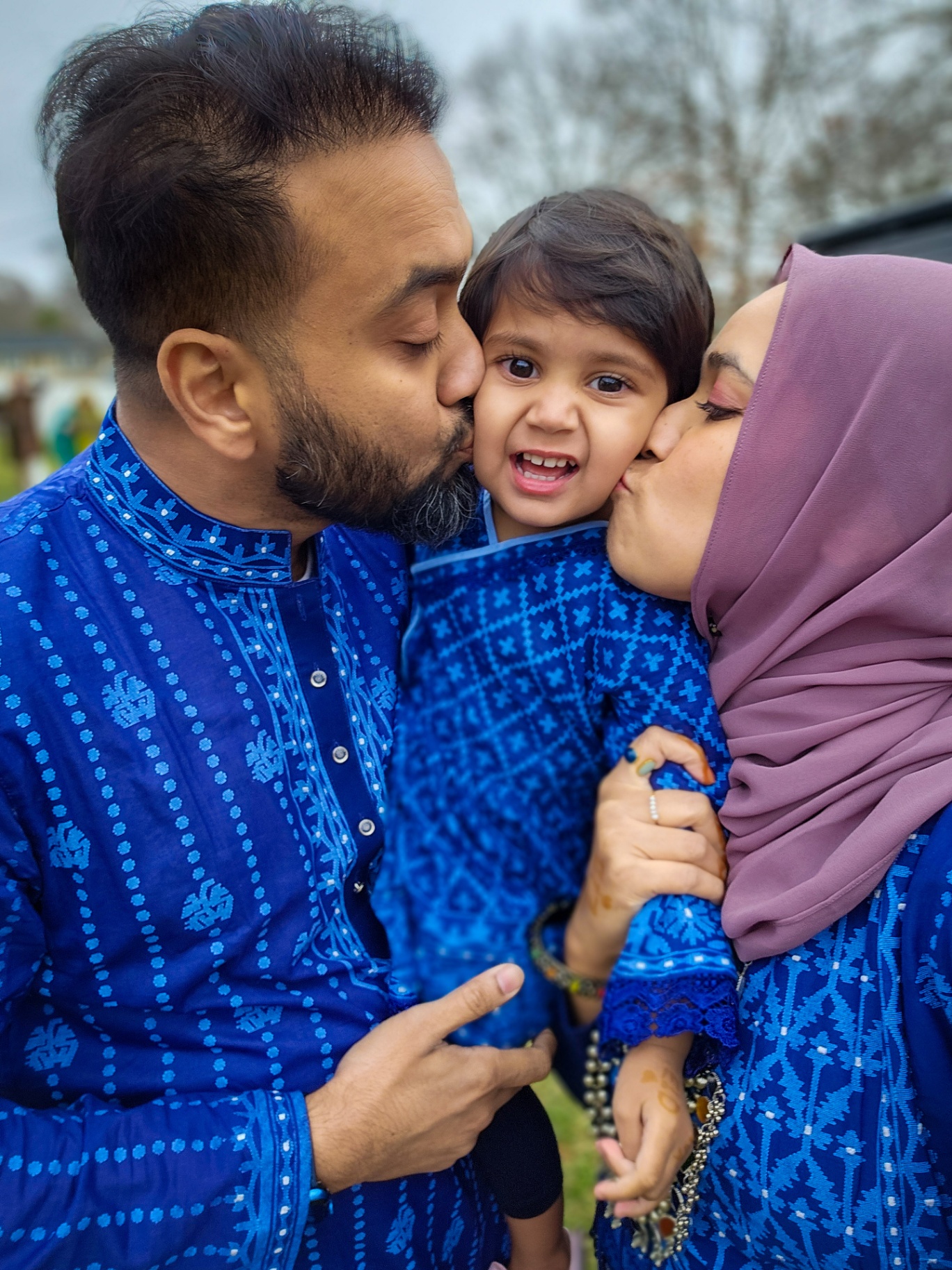 Faatiha with her parents in blue outfits