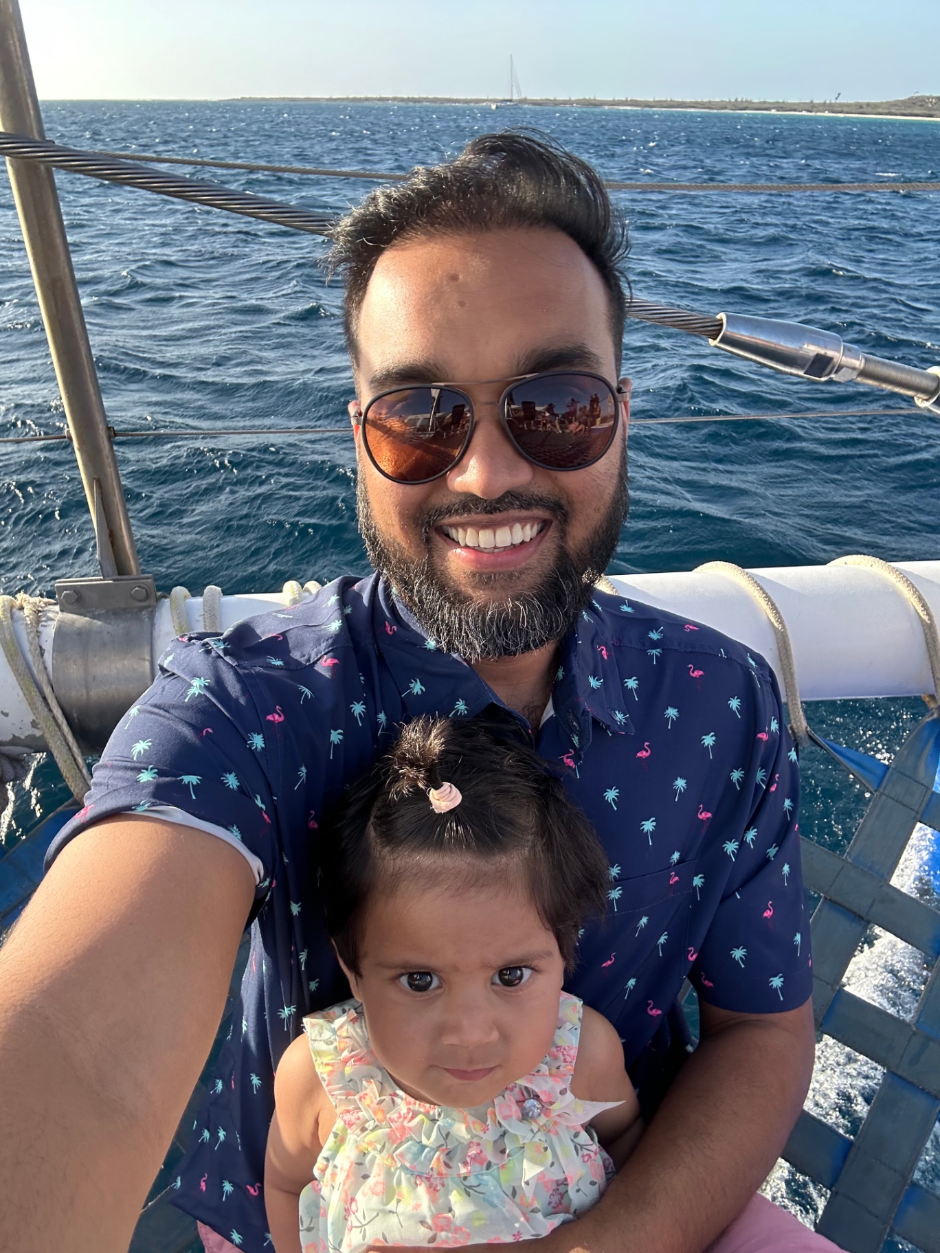 Faatiha with her dad on a sailboat