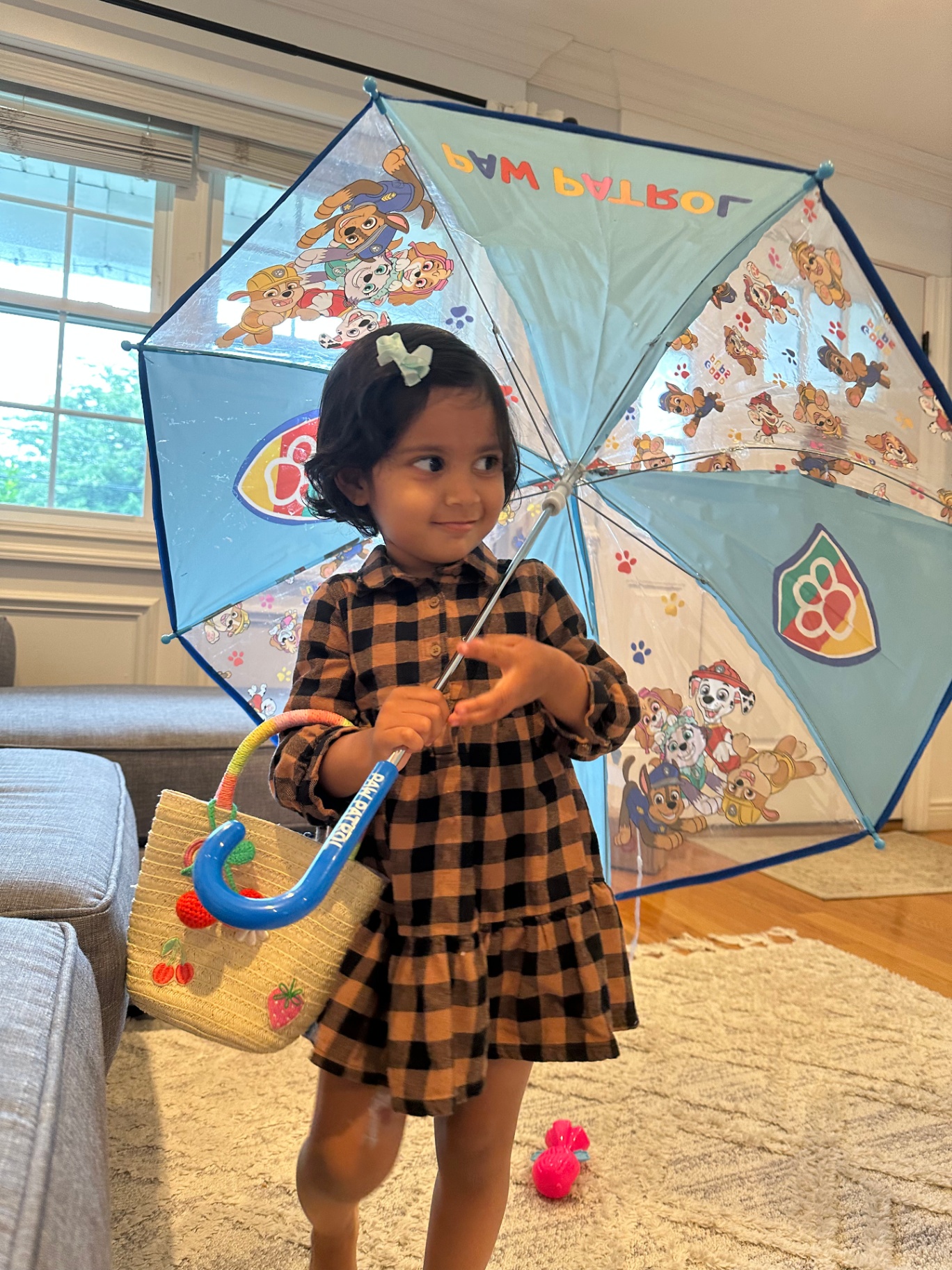 Faatiha with her Paw Patrol umbrella